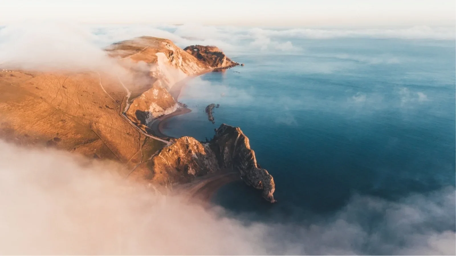 An open sea horizon and a quiet Dorset coastline