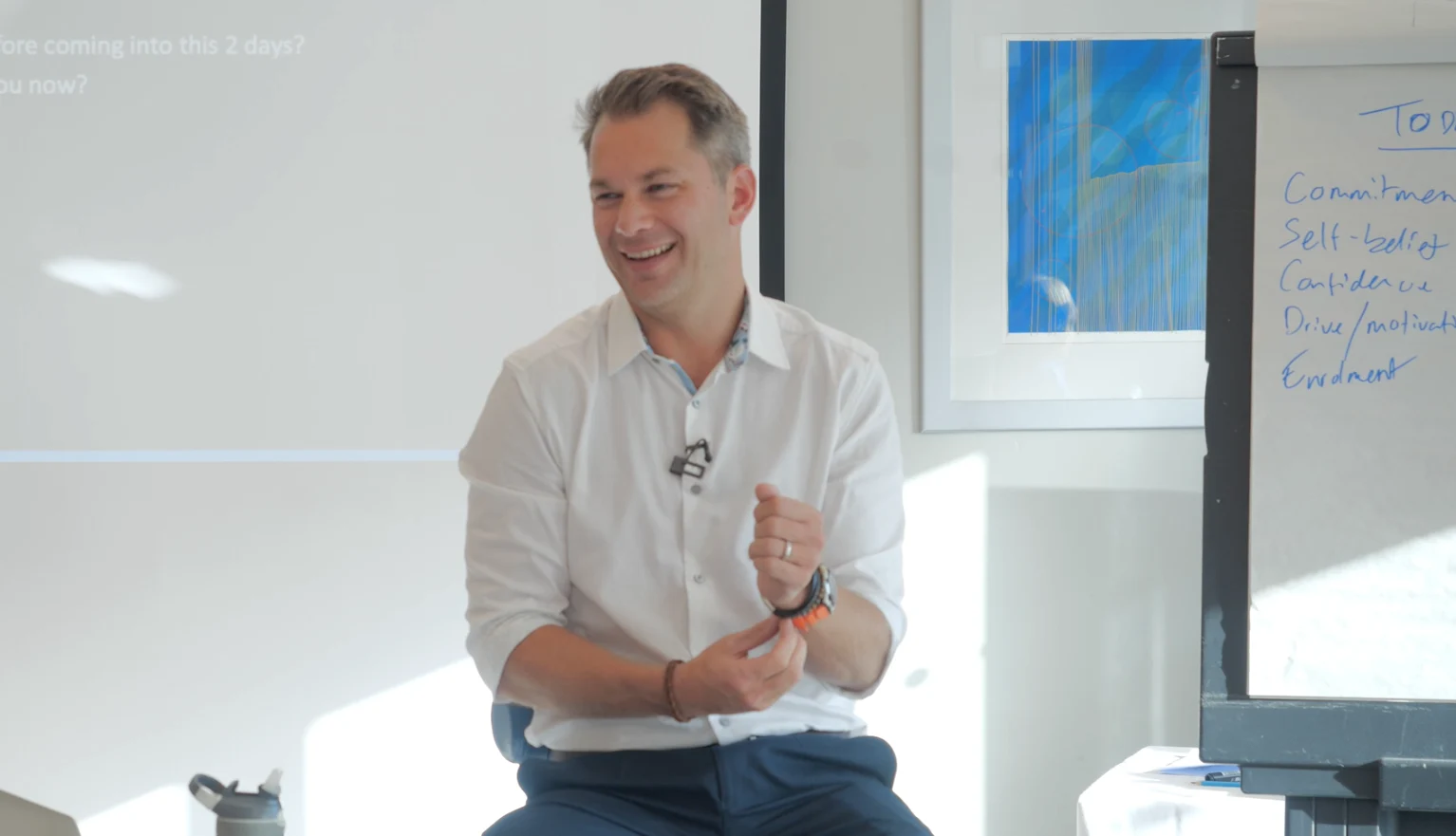 Chris Finn leading a workshop beside a flipchart